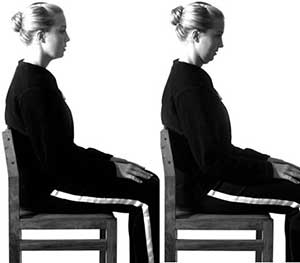 Woman demonstrating seated chin tuck posture exercise