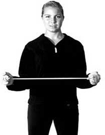 Woman performing resistance band shoulder rehabilitation exercise
