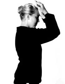 Woman performing isometric neck flexion exercise